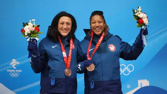 Elana Meyers Taylor and Sylvia Hoffman celebrate their bronze medal in the two-woman bobsled at the Beijing Games.