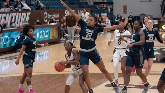 Essence Brown looks to block against St. Bonaventure
