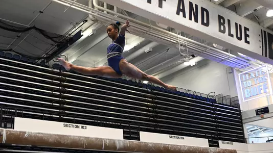 Deja Chambliss competes on beam at Lindsey Ferris Invitational
