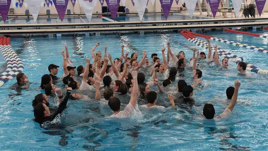 GW swimming and diving celebrates its A-10 titles.