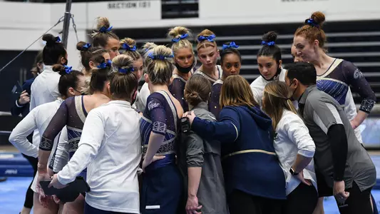 Gymnastics huddles at Lindsey Ferris
