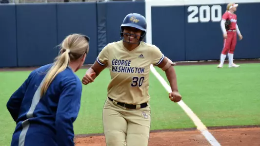 Mia Parker celebrates a home run vs. Rutgers.