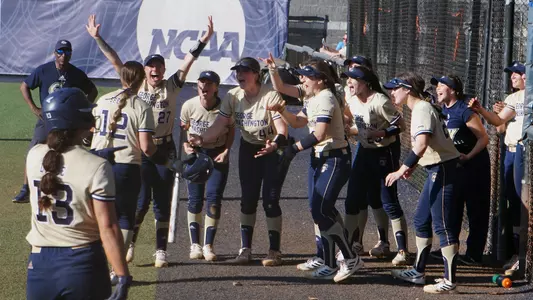 GW softball celebrates a home run from Maddie Spell.