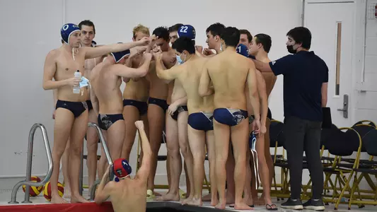 GW men's water polo huddles vs. Fordham.