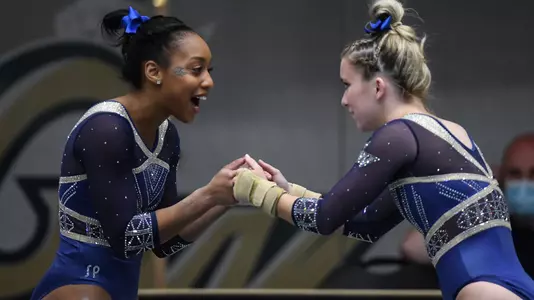 Kendall Whitman and Deja Chambliss fist bump at Lindsey  Ferris