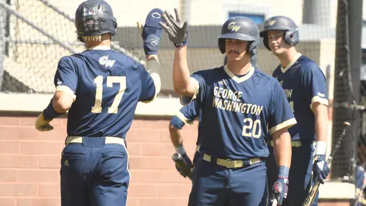 Anthony Frechette and Cade Fergus high-five against St. Bonaventure