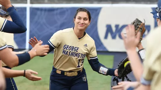 Sierrra Lange high-fives her teammates during introductions vs. Dayton.