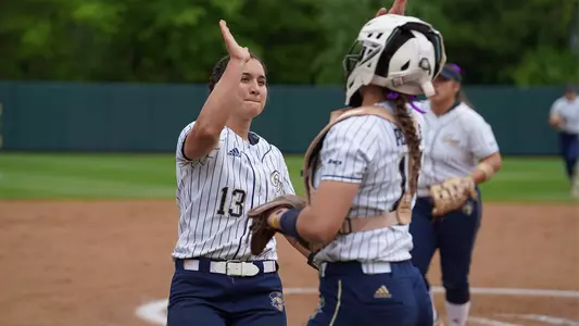 Sierra Lange high-fives Valentina Perrone.