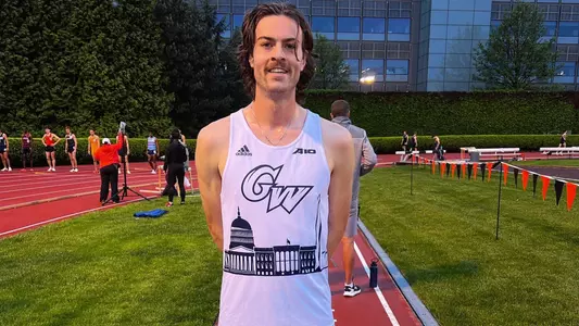 Ryan Fowkes poses following a new school record in the Men's 1500m