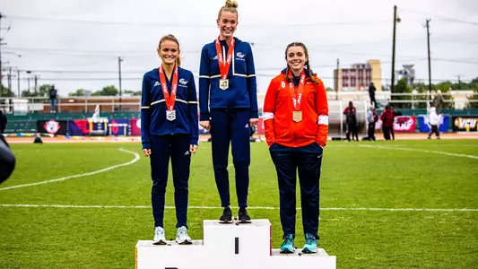 Kathryn Nohilly and Margaret Coogan on the podium at the 2022 A-10 Track & Field Championship