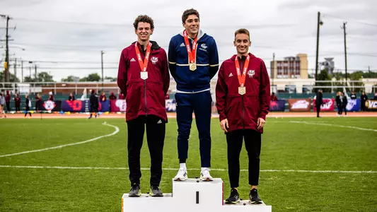 Logan Broedner on the podium at the 2022 A-10 Track & Field Championships