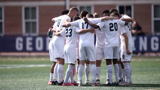 GW men's soccer huddles before taking on Saint Louis.