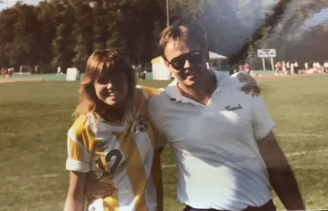 Suzy Weil poses with Head Coach Adrian Glover.