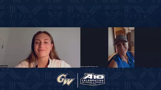 GW women's basketball alumna Cathy (Neville) Cranberg ('95) talks with Faith Blethen.