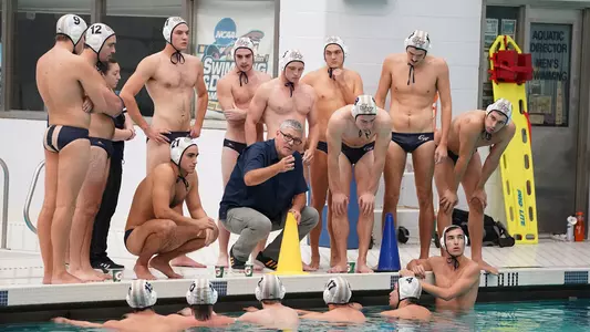 Men's Water Polo huddles around Barry King