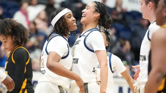 Asjah Inniss and Mia Lakstigala celebrate at home against VCU
