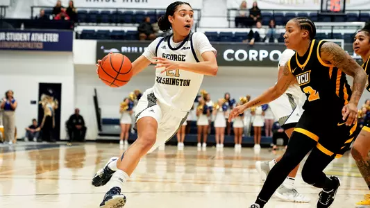 Mia Lakstigala drives to the hoop against VCU at the Smith Center