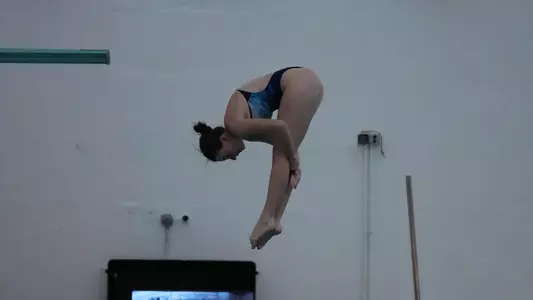Olivia Rosen diving into the smith center pool