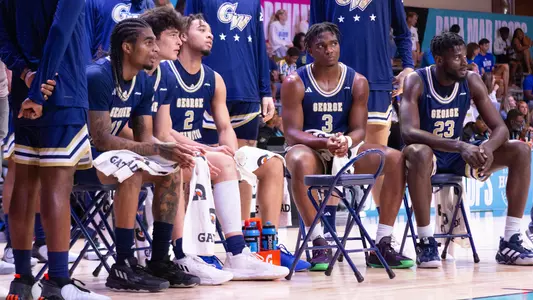Men's Basketball sits down during a timeout in the Bahamas