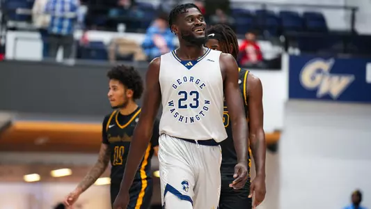 Babatunde Akingbola smiles after a block vs. Coppin State