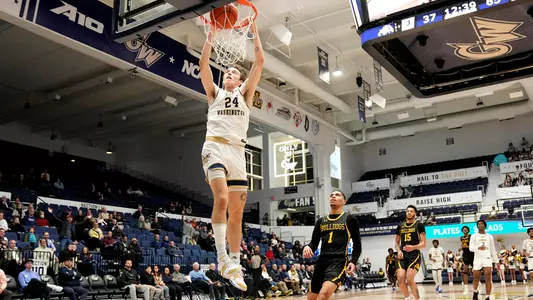 Benny Schröder rises for a dunk vs. Bowie State