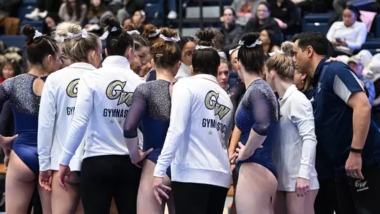 Gymnastics huddles at Lindsey Ferris Invite