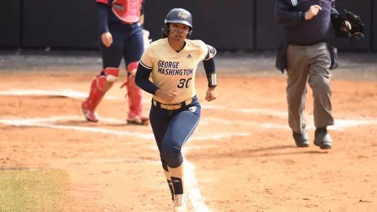 Mia Parker running to first base