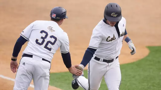 Michael Kohn rounds third after a home run