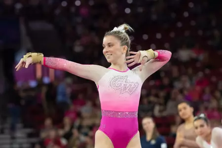 Kendall Whitman performs on floor at Denver