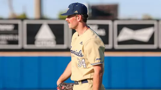 Michael Kohn standing at first base