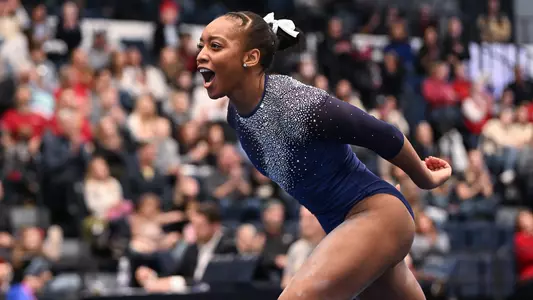Deja Chambliss celebrates a floor routine at Lindsey Ferris