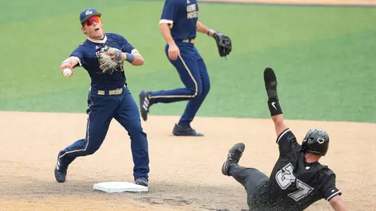 Noah Levin throws a ball to first base