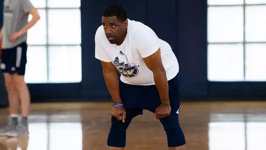 Lamont Franklin observes practice during a summer workout