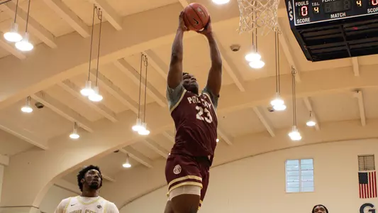 Darren Buchanan skies for a dunk at the 2023 Kenner League