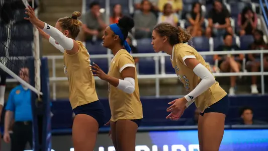 Salem Yohannes, Liv Womble and Haylee Brown at the net vs Howard