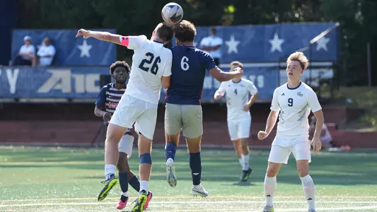 Carter Humm fighting for a header vs. Howard