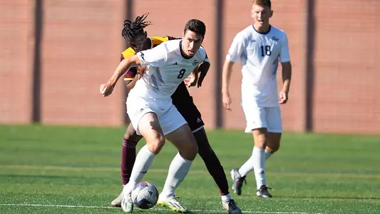 Tim Neumann shielding the ball vs Iona