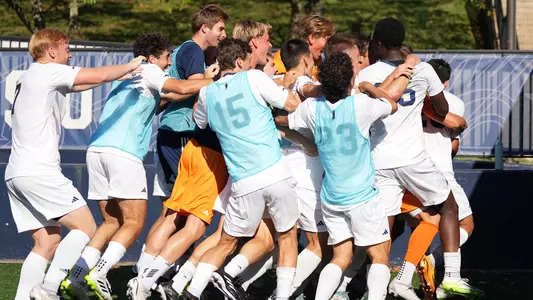 Men's Soccer celebrates a goal at the GW Soccer Field