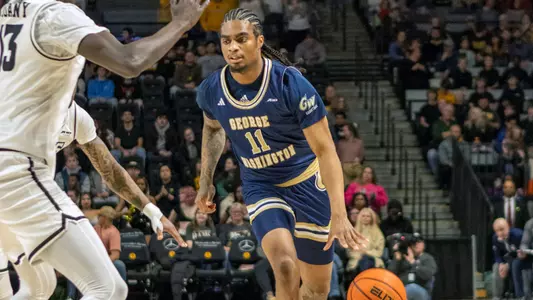James Bishop dribbles the ball up the court at VCU