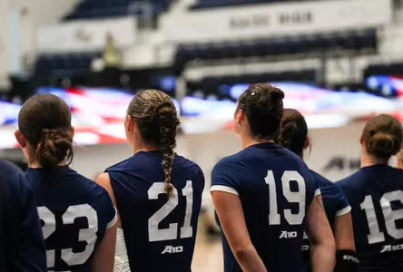 Volleyball Players Stand for National Anthem