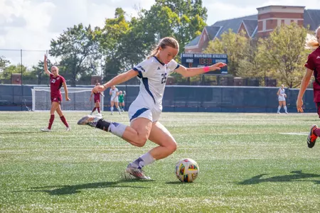 Amelia Booth sets up a Cross vs. UMass