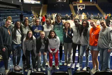 Jonquel Jones with the 2024 GW Women's Basketball Team