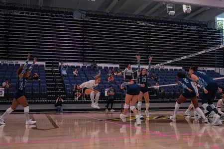 Volleyball Celebrates a Win over Fordham