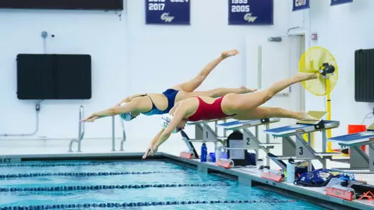 Women's swimmers diving into Smith Center pool at practice