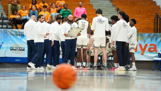 Men's basketball huddles during the Paradise Jam