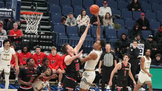 Rafael Castro hooks a shot over a defender vs. UVA Wise