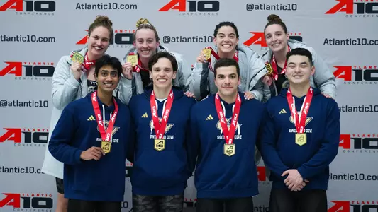 Both Men's and Women's GW 200-yard medley relays posing with their gold medals