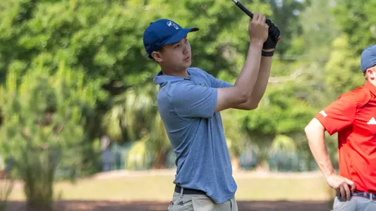 Jed Dy swings the driver at the Atlantic 10 Championship