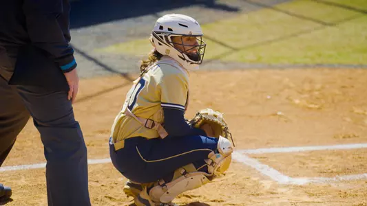 Allison Heffley in a catching stance at the GW Softball Field