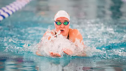 Ava Deangelis swims breaststroke at the 2024 A-10 Championships